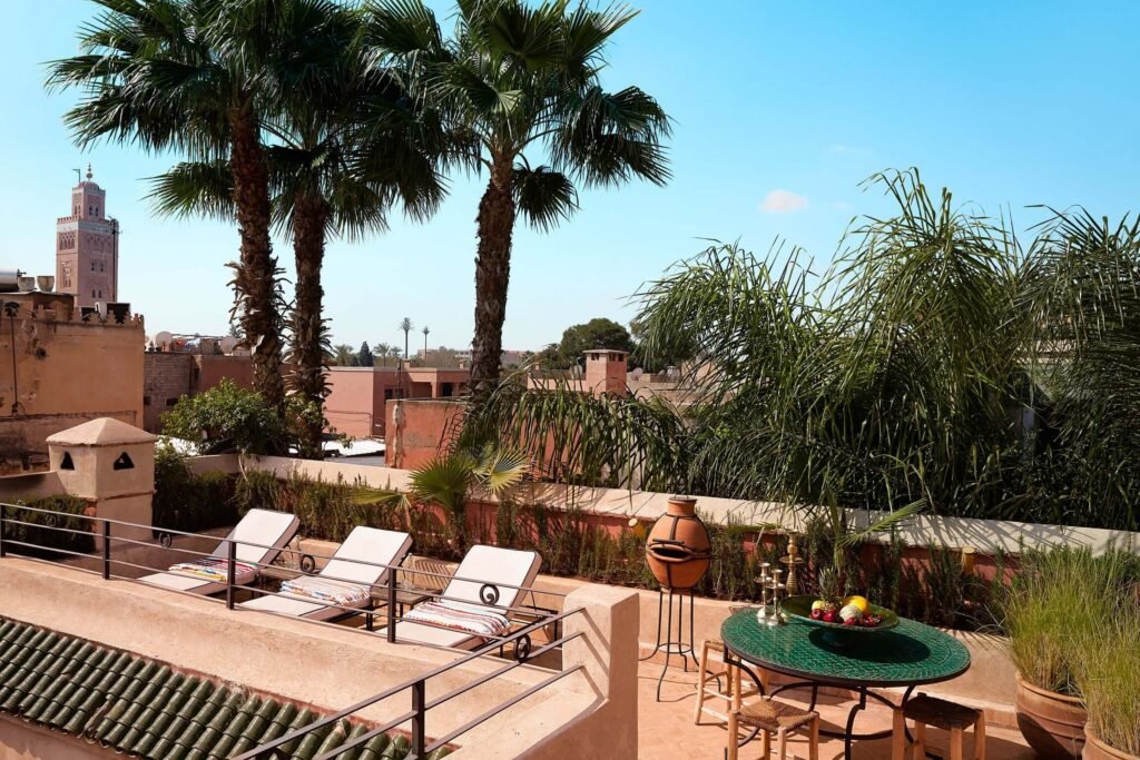 Rooftop lounge area at El Fenn with sunbeds and relaxed Marrakech atmosphere