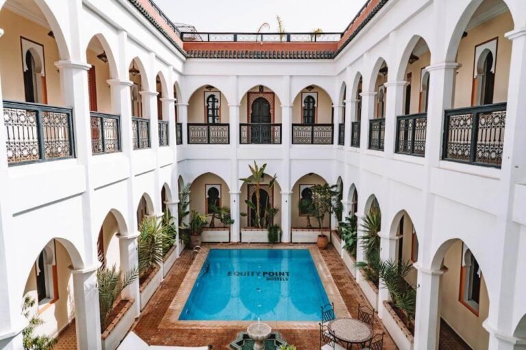 Equity Point Marrakech courtyard with pool and social spaces for budget travelers in the Medina