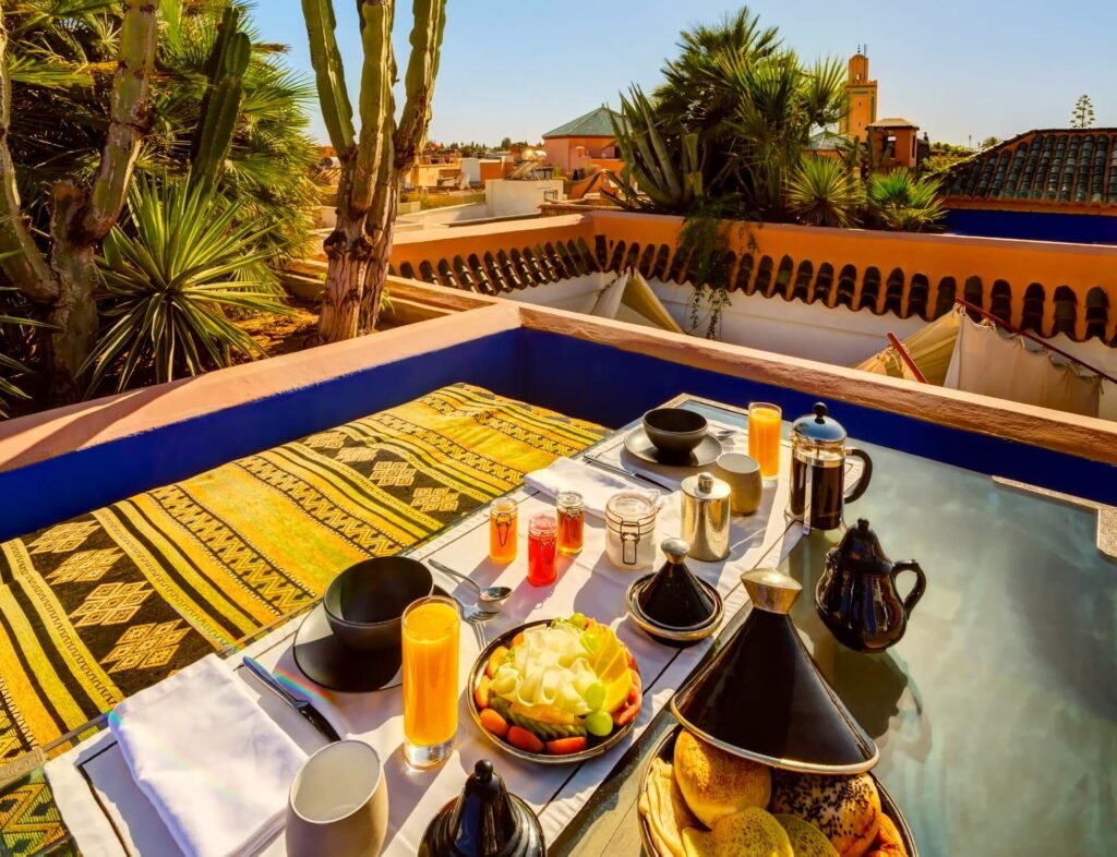 Intimate rooftop dining at Riad Farnatchi with candlelight and Medina views