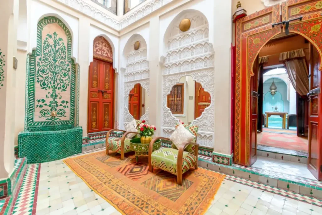 Peaceful courtyard at Riad Hikaya with elegant pool, soft tones, and intimate adults-only atmosphere