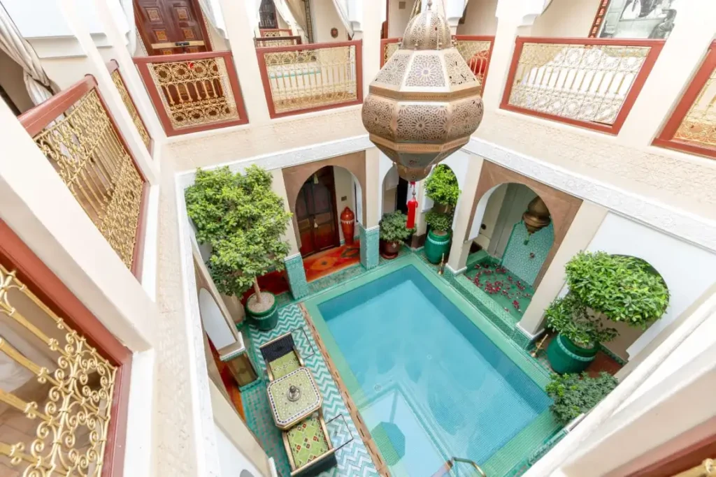Interior of Riad Hikaya showcasing refined design, arches, and calm boutique riad ambiance