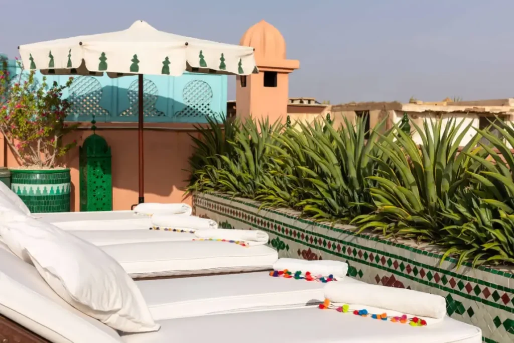 Rooftop terrace at Riad Hikaya with relaxed seating and peaceful views over the Medina