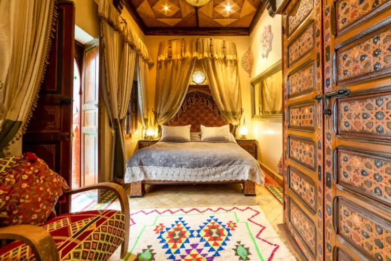 Comfortable room at Riad Hikaya featuring warm tones, soft lighting, and elegant details