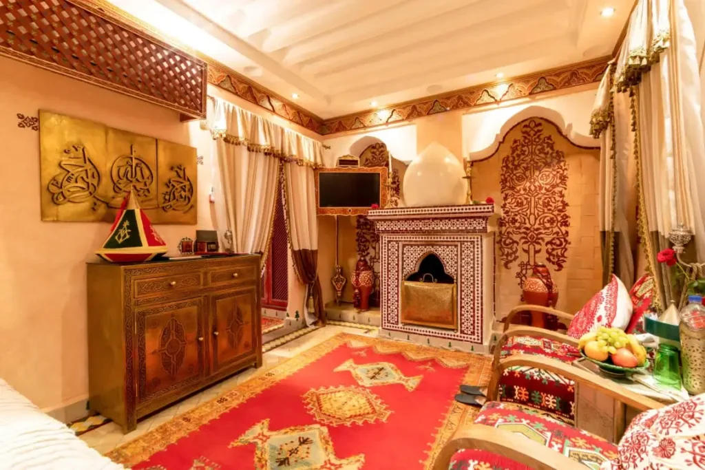 Refined luxury suite at Riad Hikaya with neutral palette, elegant decor, and cozy ambiance