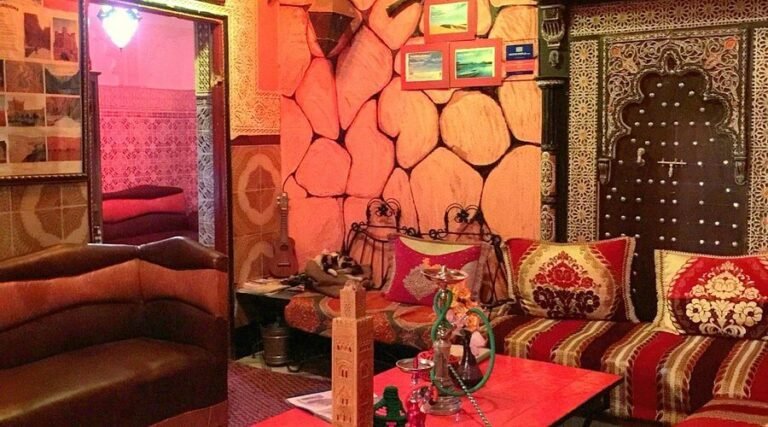 Riad Marrakech Rouge courtyard with Moroccan decor and simple, cozy rooms in Marrakech Medina