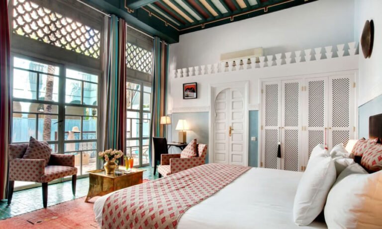 Elegant room at Les Jardins de la Médina with garden view and soft natural Moroccan design