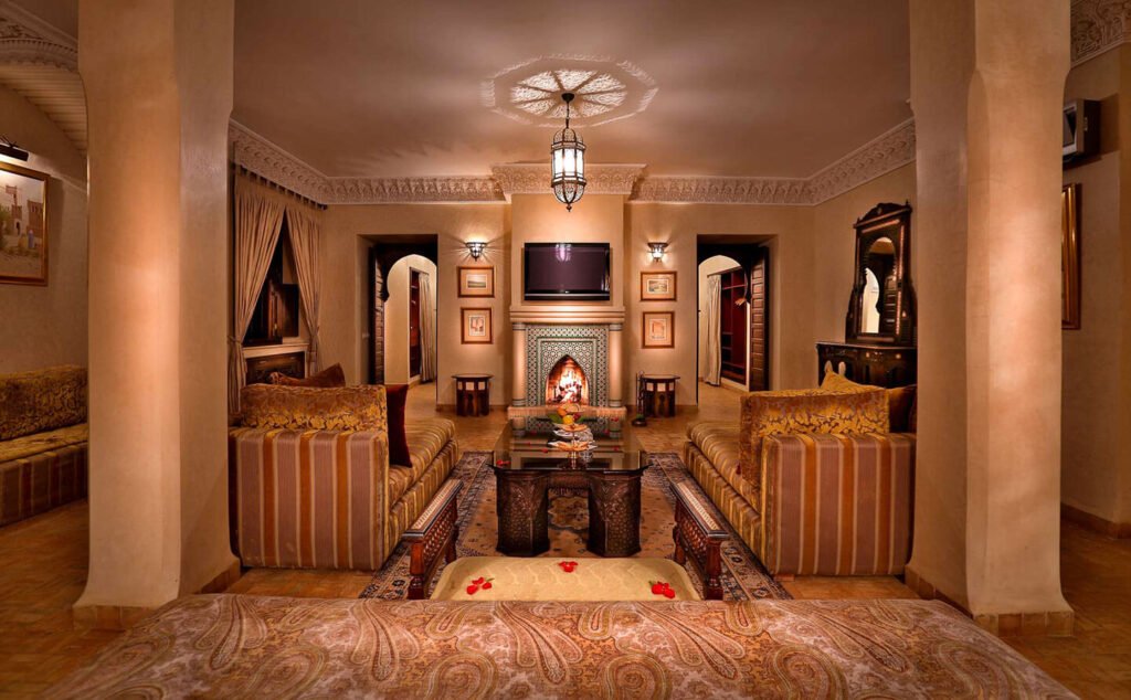 Luxury suite at Riad Kniza Marrakech with antique furniture and heritage Moroccan design