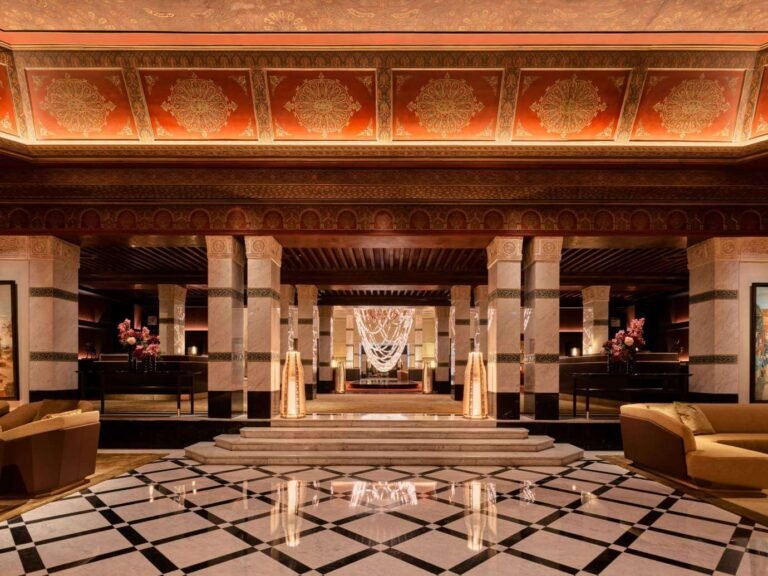 La Mamounia exterior with lush gardens and pool, luxury hotel in Marrakech