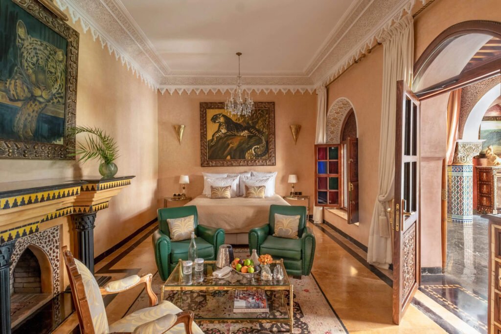 Elegant room at La Sultana Marrakech with carved wood details and traditional Moroccan decor