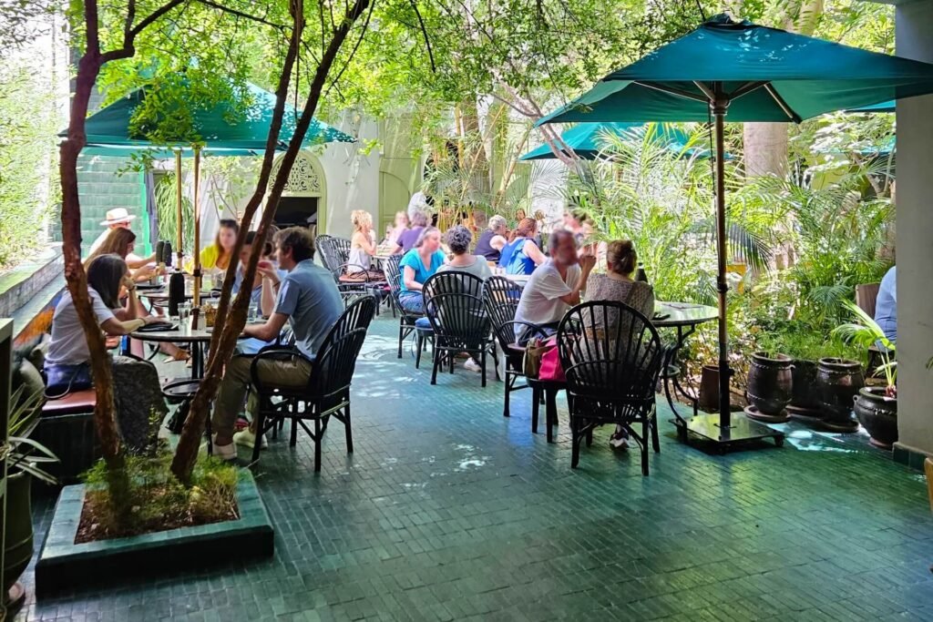 Le Jardin Marrakech courtyard restaurant with lush greenery and traditional Moroccan dining