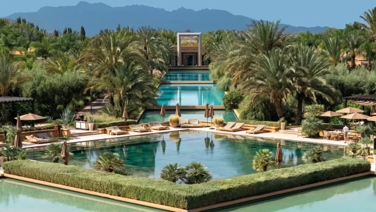 Aerial view of Mandarin Oriental Marrakech resort with villas, pools, and landscaped gardens