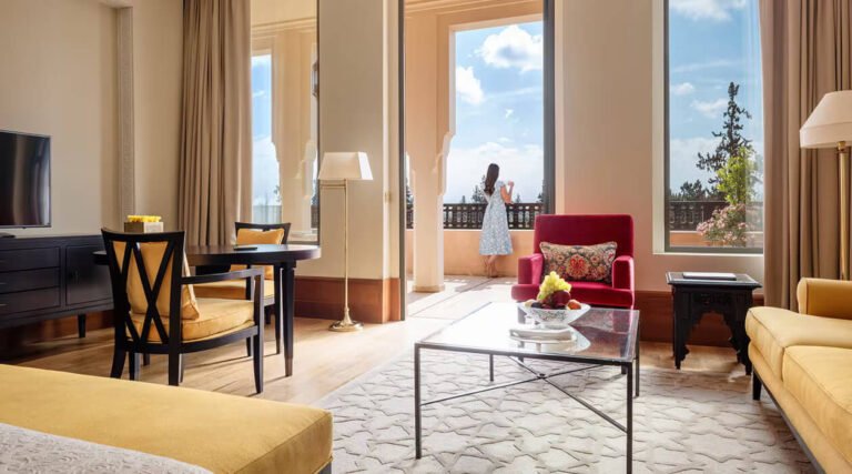 Deluxe room at The Oberoi Marrakech with private terrace overlooking landscaped gardens