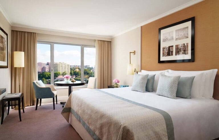 Luxury room at Palais Namaskar with soft tones, natural light, and peaceful ambiance