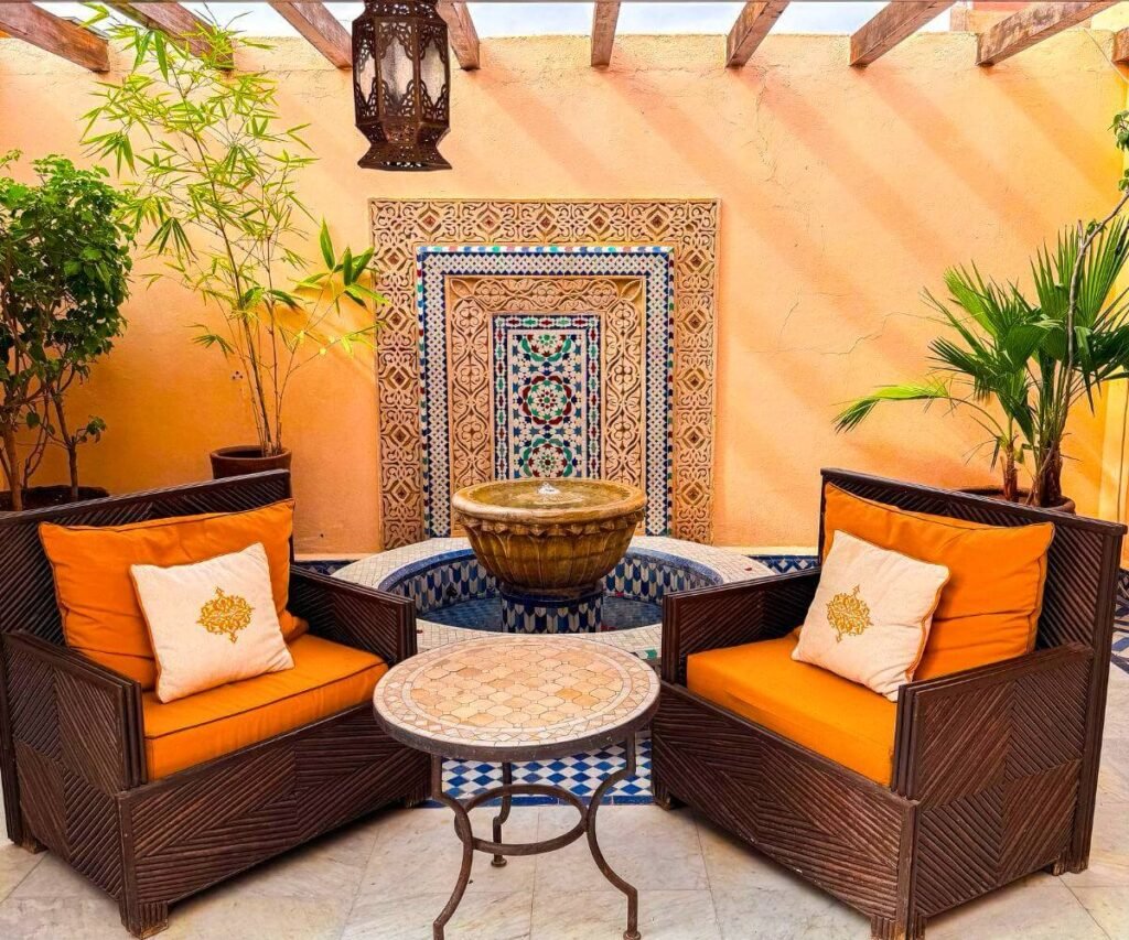 Grand courtyard at Riad Palais Sebban with fountain, zellige tiles, and historic palace architecture