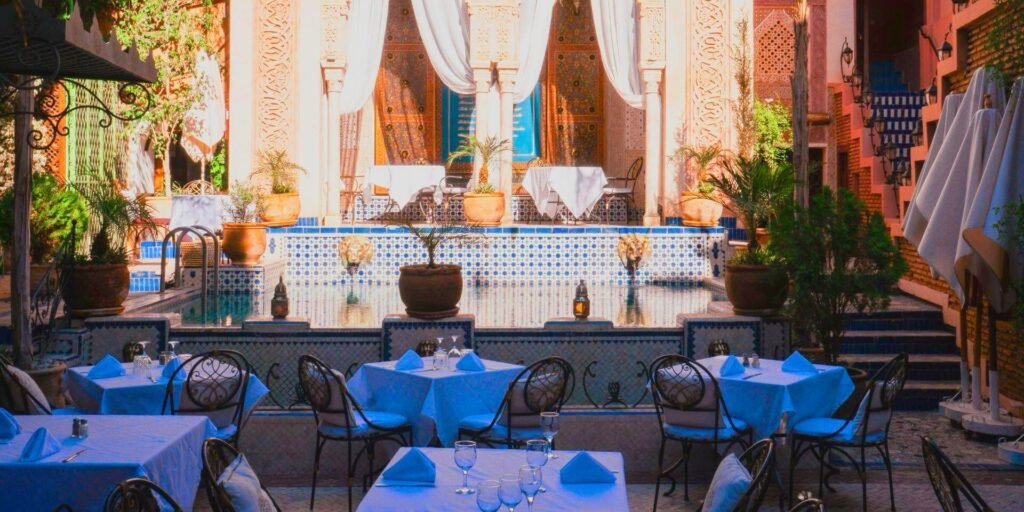 Elegant dining area at Riad Palais Sebban with arched ceilings and traditional Moroccan fine dining setting