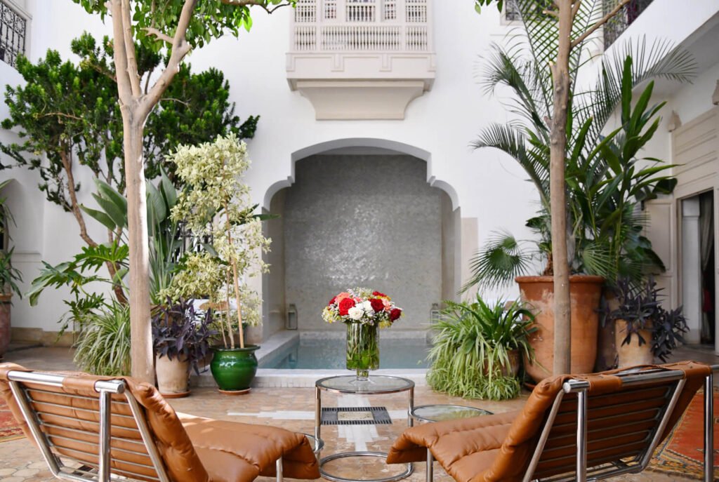 Riad Al Massarah courtyard with Moroccan design, plunge pool, and cozy boutique-style rooms in Marrakech Medina