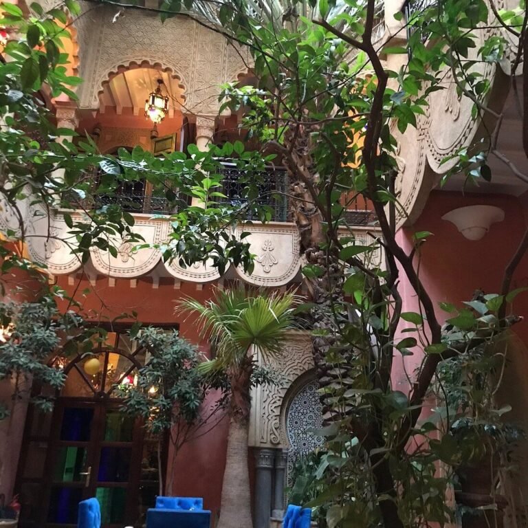 Riad Atlas IV & Spa courtyard with traditional Moroccan decor and budget-friendly rooms in Marrakech Medina