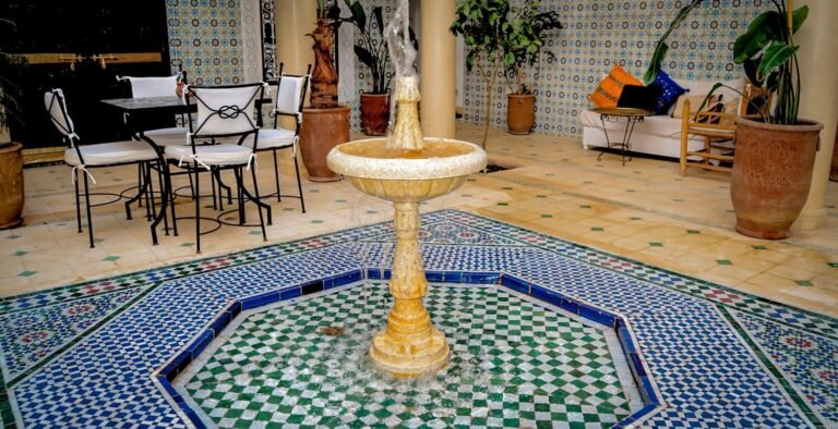 Riad Dar Hamid courtyard with traditional Moroccan architecture, plants, and seating area in Marrakech Medina