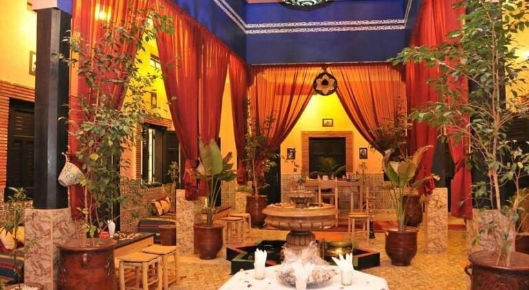 Riad El Kennaria rooftop terrace with traditional Moroccan design and views over Marrakech Medina
