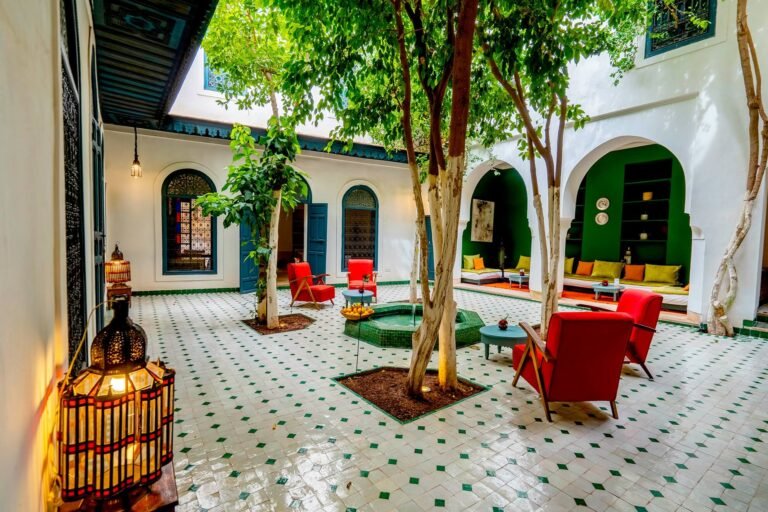 Riad Dar Sara courtyard with traditional Moroccan architecture, cozy seating, and a tranquil ambiance in Marrakech Medina