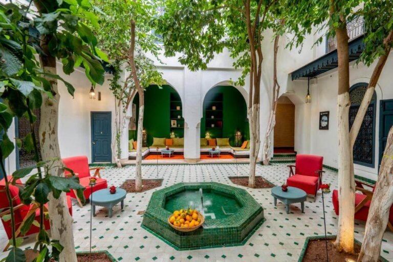 Riad Dar Sara courtyard with traditional Moroccan architecture, cozy seating, and a tranquil ambiance in Marrakech Medina