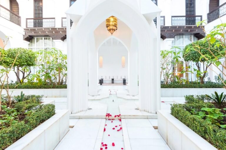 Riad Elisa courtyard with pool, elegant Moroccan decor, and relaxing spa ambiance in Marrakech Medina