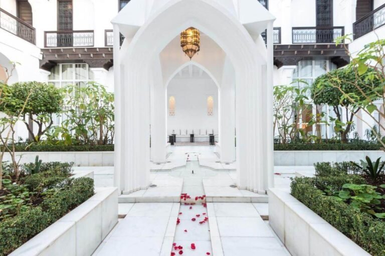 Riad Elisa courtyard with pool, elegant Moroccan decor, and relaxing spa ambiance in Marrakech Medina