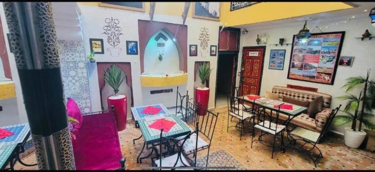 Riad Layla Rouge colorful courtyard with social spaces and budget-friendly rooms in Marrakech Medina
