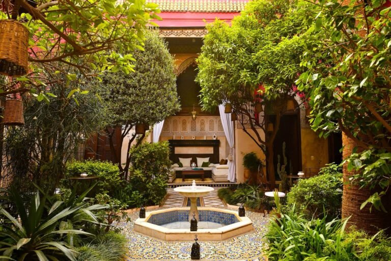 Riad Aziza courtyard with pool, elegant Moroccan decor, and spa facilities in Marrakech Medina