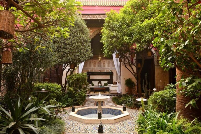 Riad Aziza courtyard with pool, elegant Moroccan decor, and spa facilities in Marrakech Medina