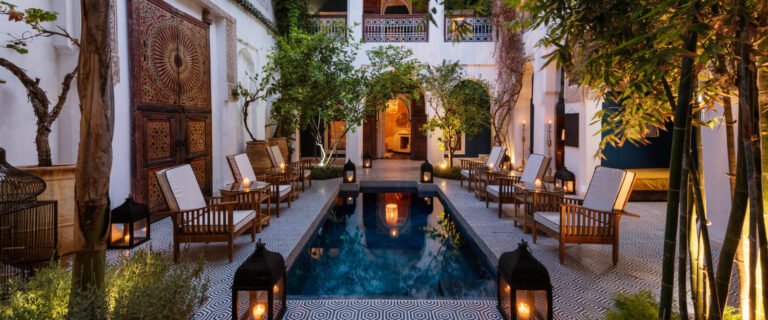 Riad Les Yeux Bleus Marrakech vibrant courtyard with pool and Moroccan mosaic tiles