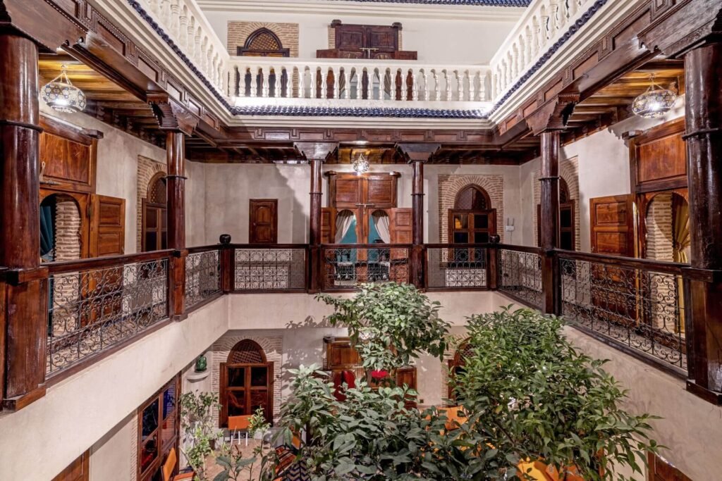 Maïpa Boutique Riad rooftop terrace with Moroccan decor and a serene courtyard in the Medina of Marrakech