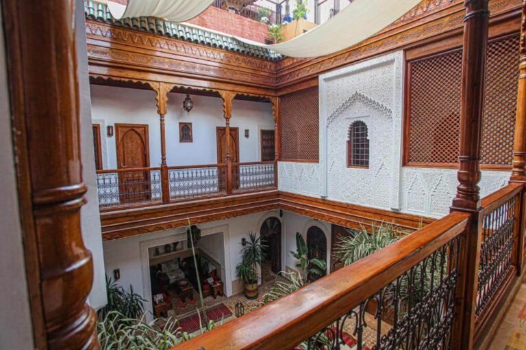 Patio space at Riad Melhoun with arches, zellige tiles, and classic Moroccan architecture
