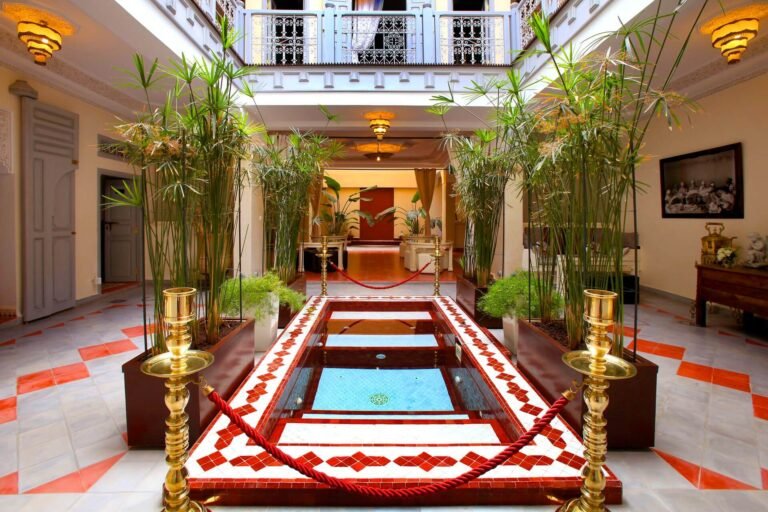 Riad Noos Noos courtyard with traditional Moroccan decor, pool, and rooftop terrace in Marrakech Medina