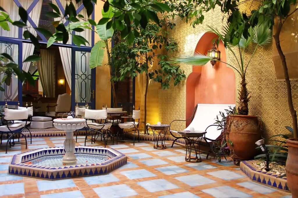 Riad Soundouss rooftop terrace and courtyard with Moroccan décor and budget-friendly rooms in Marrakech Medina
