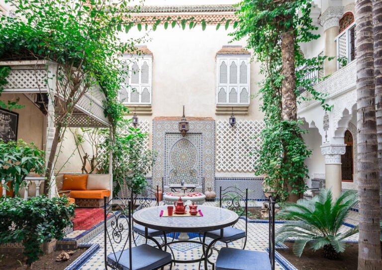Riad Tahyra courtyard with Moroccan decor and cozy budget rooms in Marrakech Medina