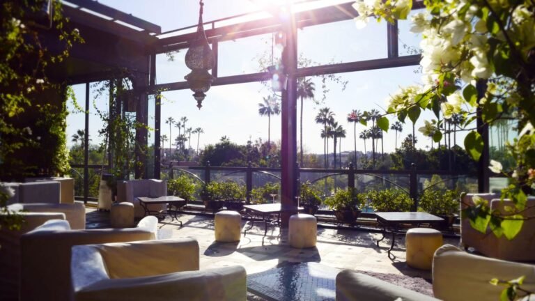 Riad Wow rooftop terrace with pool, modern Moroccan design, and views over the Marrakech Medina