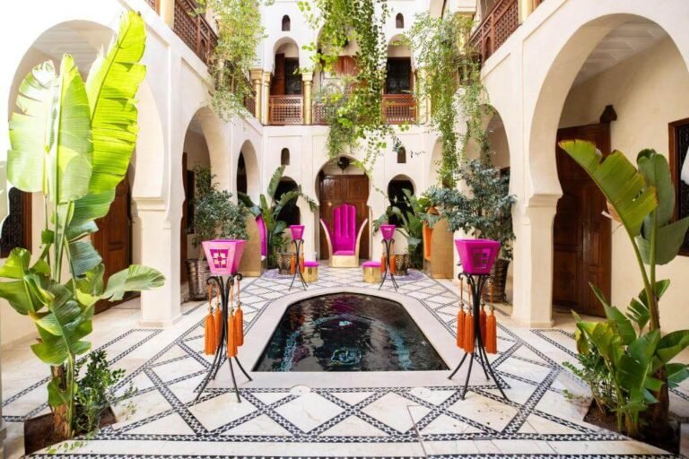 Riad Wow rooftop terrace with pool, modern Moroccan design, and views over the Marrakech Medina