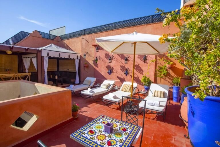 Rooftop terrace at Riad Christina with relaxing seating and views over Marrakech Medina