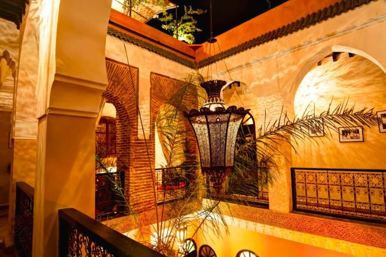 Riad Jona courtyard with Moroccan decor and simple budget-friendly rooms in Marrakech Medina