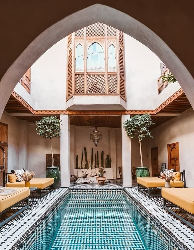 Riad BE Marrakech colorful courtyard with pool and bohemian decor