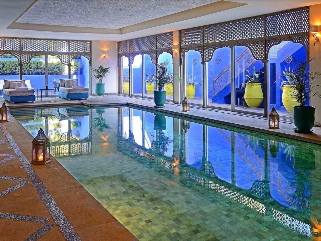 Heated indoor pool with decorative Moroccan details at Sofitel Spa in Marrakech.