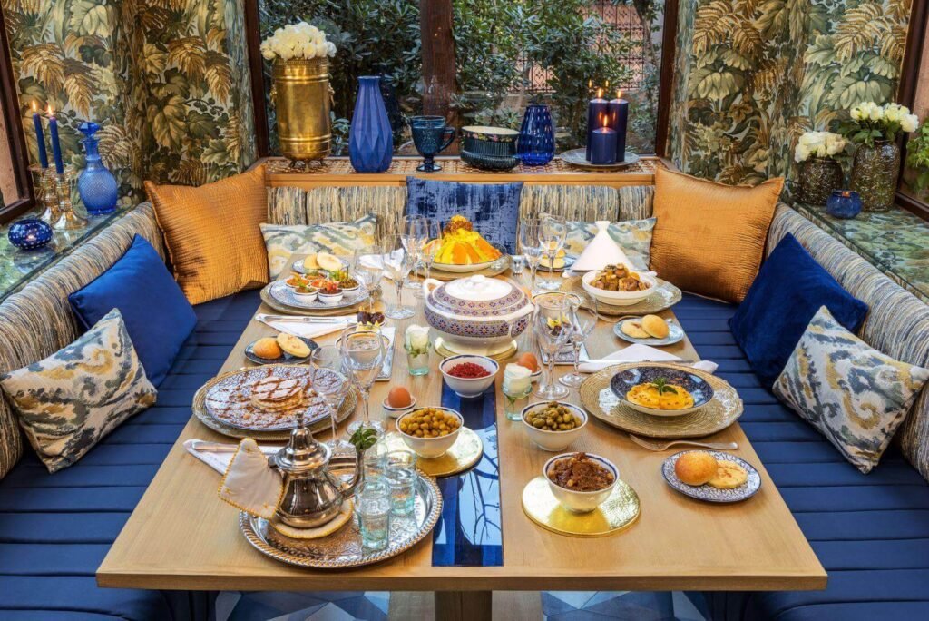 Lallati restaurant surrounded by lush greenery at Tigmiza Boutique Hotel & Spa in Marrakech.