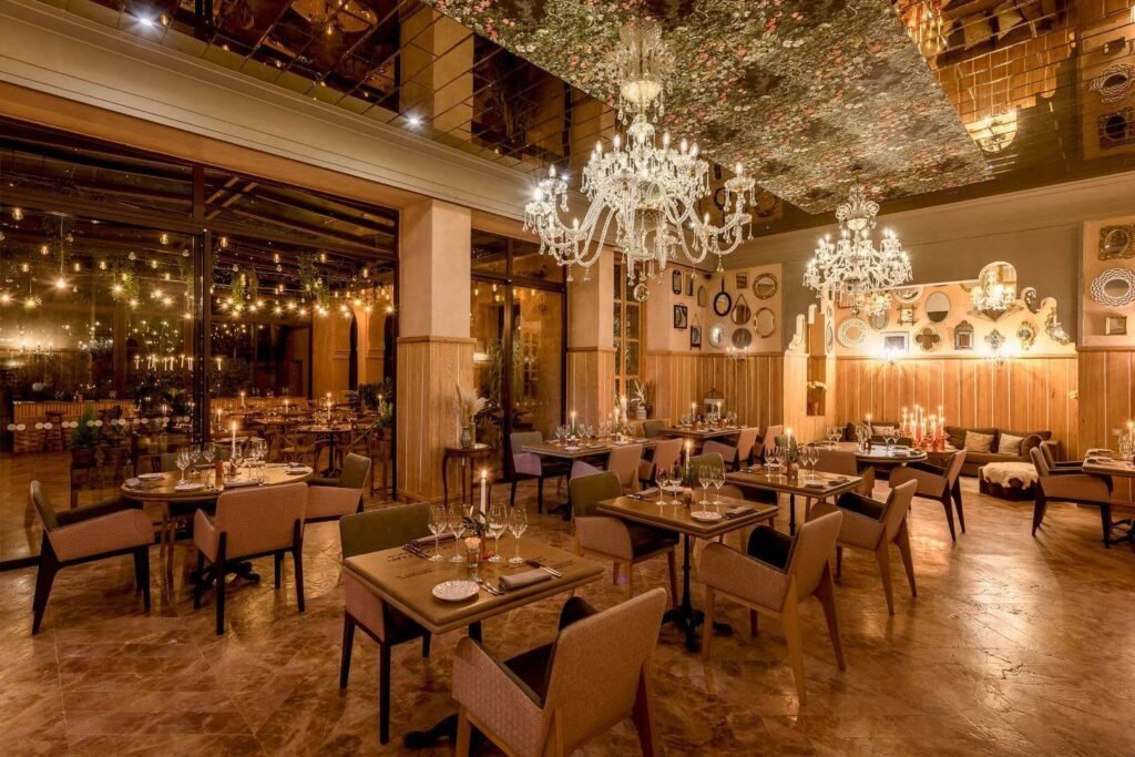 Warm terracotta-toned dining room at Libiti restaurant in Tigmiza Boutique Hotel & Spa, Marrakech.